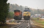 CSX 9 and BNSF 7567 are side by side